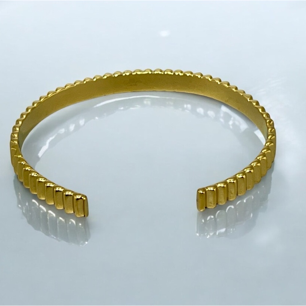 OMA “The Label” Gold Tone Textured Bangle Bracelet